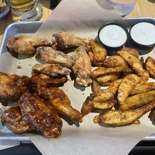 10 Traditional Wings. Caribbean Jerk and Lemon Pepper season.  It was supposed to be a LP sauce but oh well. Potato Wedges. Shitty ranch