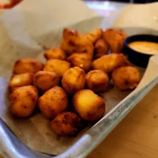Cheese curds. Eat them with caramel and they taste like a funnel cake.