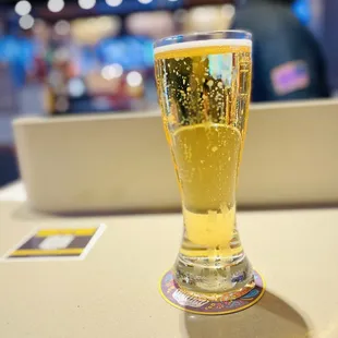 a glass of beer on a table