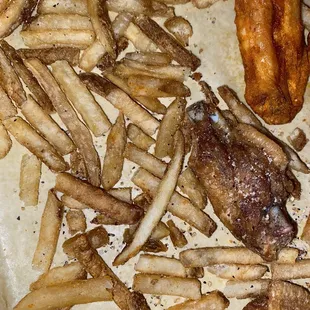 a plate of chicken wings and french fries