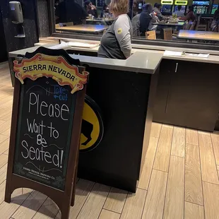 a woman sitting at a counter