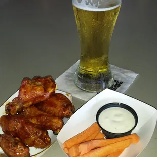Snack size wings, cold beer and a side of carrots with blue cheese.
