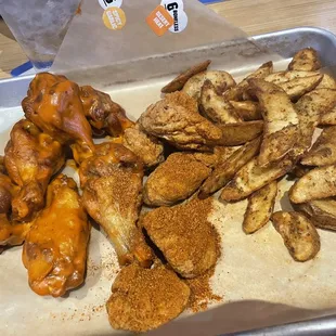 6 Boneless Wings 6 Traditional Wings Potato Wedges Desert Heat on boneless and Spicy Garlic on bones.