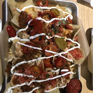 Ultimate chicken nachos add chili and everything they got!