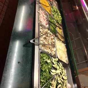 a variety of salads in a buffet