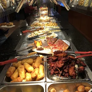 a variety of food items in a buffet