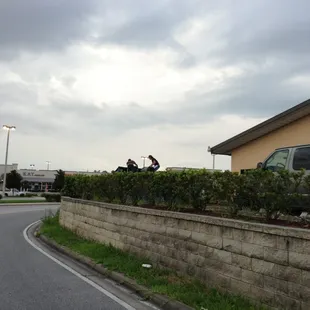 This is the friendly kitchen staff climbing in the dumpster with their kitchen apron's on and then walking back into the kitchen