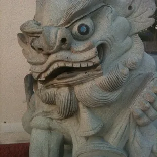 a stone statue of a mythical creature