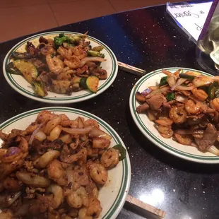 three plates of food on a table