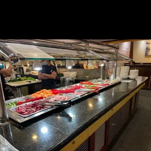 a man standing in front of a buffet