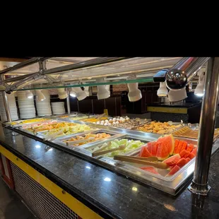 a variety of food in a buffet