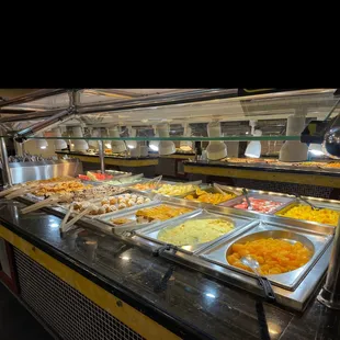 a variety of food in a buffet