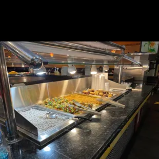 a variety of food items in a buffet