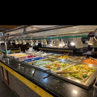 a variety of food in a buffet