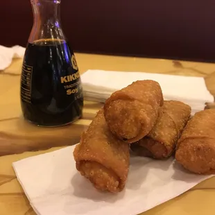 a plate of fried doughnuts and a bottle of coffee