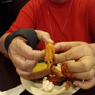 a woman holding a plate of food