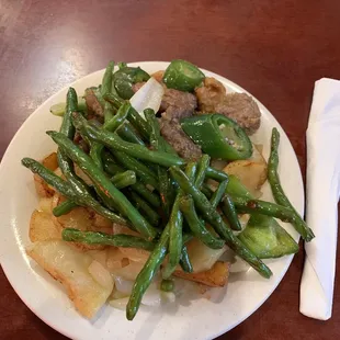 a plate of green beans and potatoes