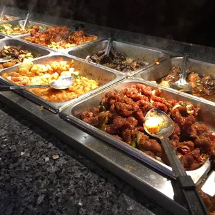 a variety of food items in a buffet