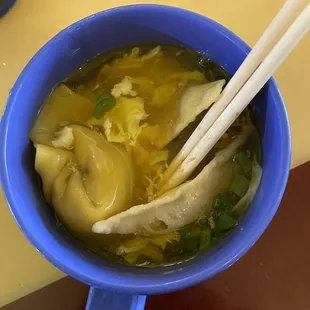 Egg drop with a beef dumpling which sits in a dumpling basket next to soup!