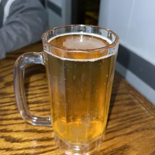 a glass of beer on a table
