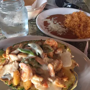 The food was authentic.  Grilled shrimp w chicken in a half pineapple.  1/2 price margaritas on Monday.