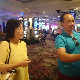 a man and woman in a casino