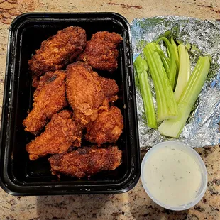 Bugsy's Famous Buffalo Wings with celery and ranch dip.