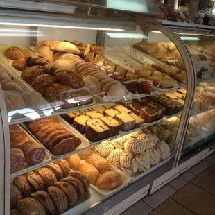 Rows and rows of fresh baked goods of the panderia variety and fresh bread 3 for 1$