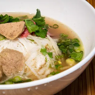 a bowl of soup with meat and vegetables