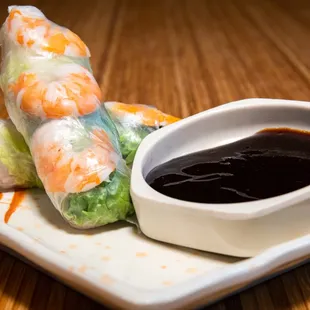 a plate of food with dipping sauce