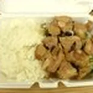 a takeout box with rice and chicken