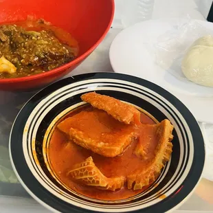 a bowl of soup and a bowl of bread