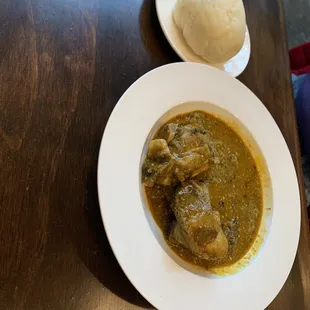 Iyan (pounded yam) and Okra soup with mixed meat.