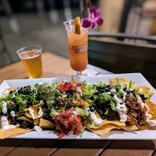 Loaded Nachos!    A brew and a Hurricane.
