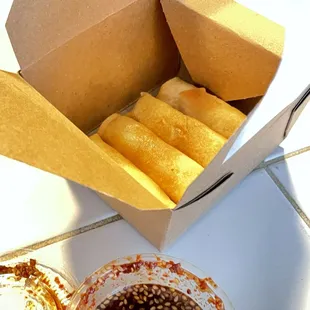 Spring Rolls, 4 pieces, $4, with tangy sauce