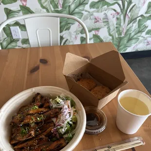 Spicy pork bulgogi bowl with 2 potato croquettes and barley tea.