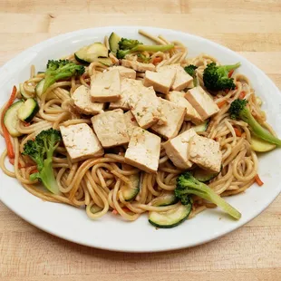 a plate of noodles and tofu