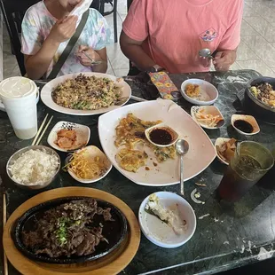 Upper left: kids bulgogi. Upper right: stone pot w/ bulgogi. Front left: bulgogi entrée. Middle: seafood pancake.