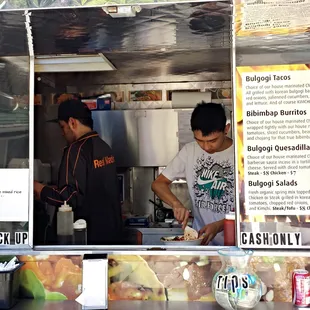 The friendly guys in the cart hard at work during a hectic lunch service