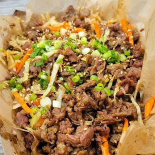 a bowl of food on a picnic table