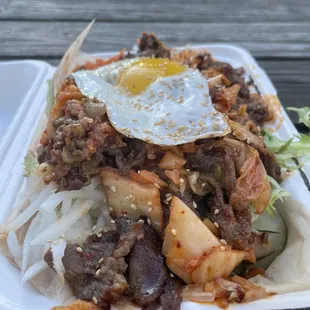 Beef bibimbap bowl with kimchi