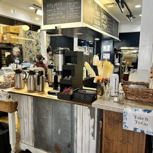 a coffee shop counter with a coffee maker