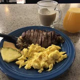 Steak and eggs with loaded hash on the side