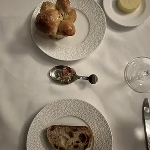 a table setting with bread and butter