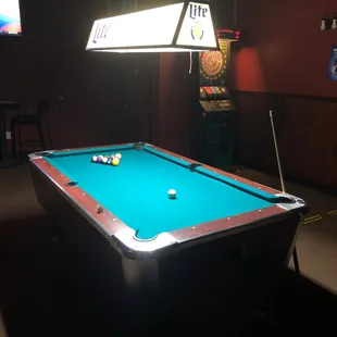 a pool table in a bar