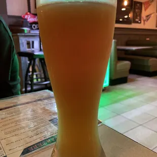 a glass of beer on a table