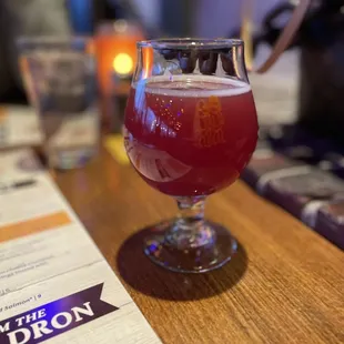 a glass of beer on a table