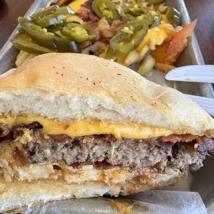 Spicy meat lovers burger with loaded waffle fries also