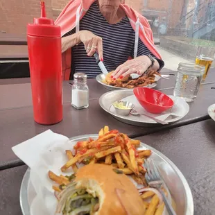 My green monster burger and dirty fries, and the legendary pickle chips empty bowl, that we inhaled, all good!