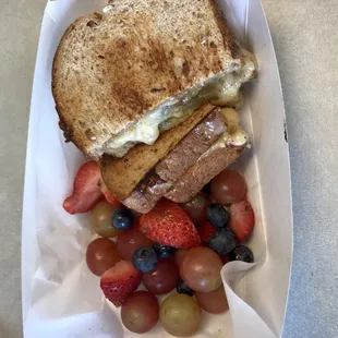 Pimento grilled cheese with fried green tomatoes &amp; side of fruit. Delicious!